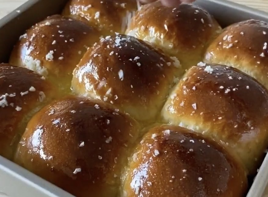 Nine golden brown rolls straight out of the oven