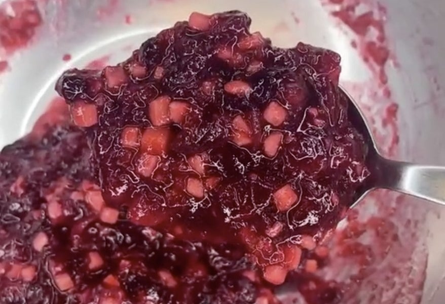 Cranberry sauce in a silver mixing bowl