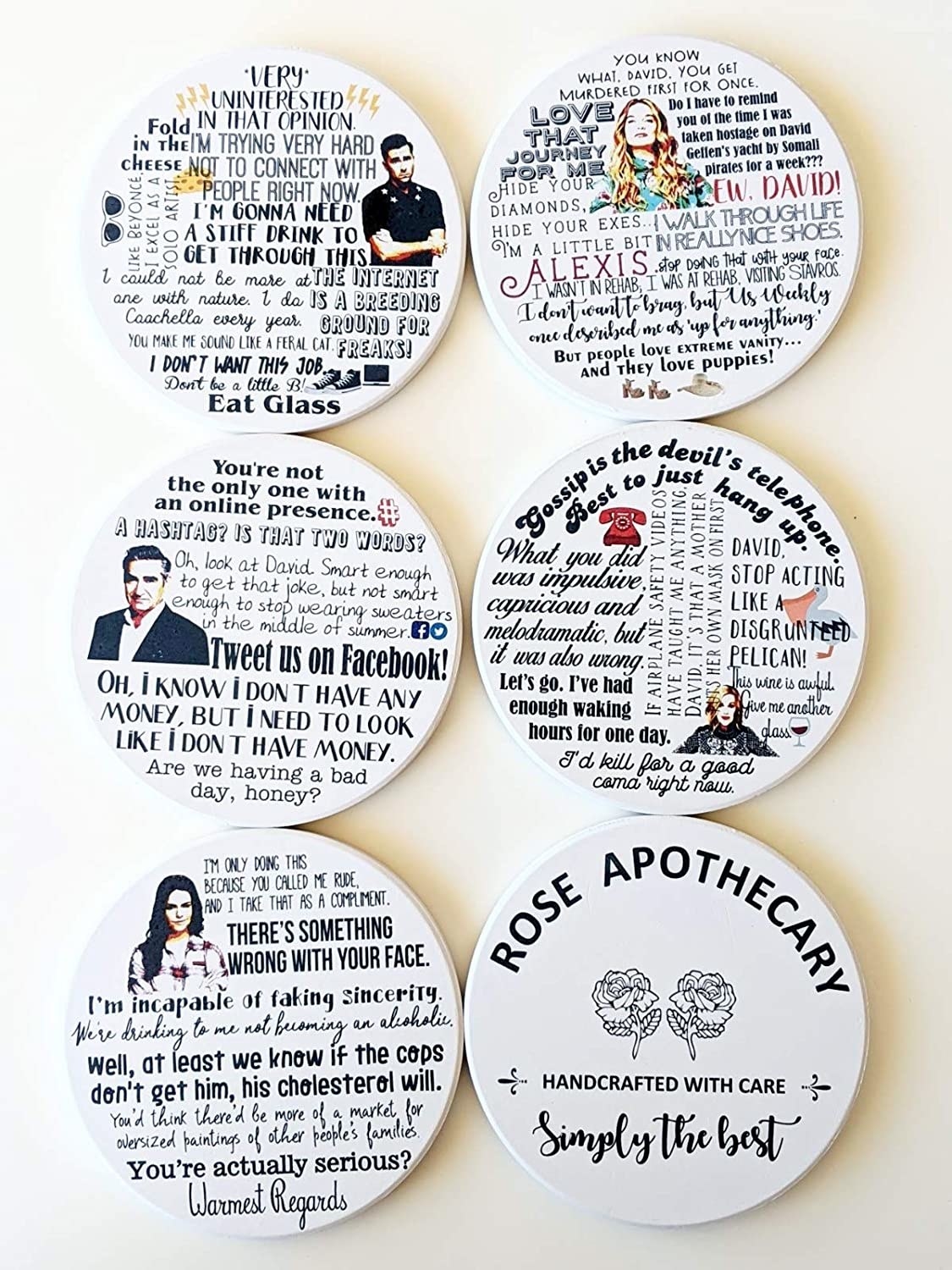 The six coasters, five of which have pictures of a different character (David, Alexis, Johnny, Moira, and Stevie) and several of their best quotes, and one of which reads &quot;Rose Apothecary handcrafted with care simply the best&quot; with the store logo