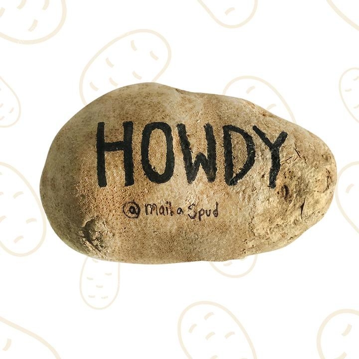 A potato with &quot;Howdy&quot; written on it