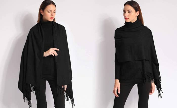 Model wearing black shawl draped over her shoulders and across her chest