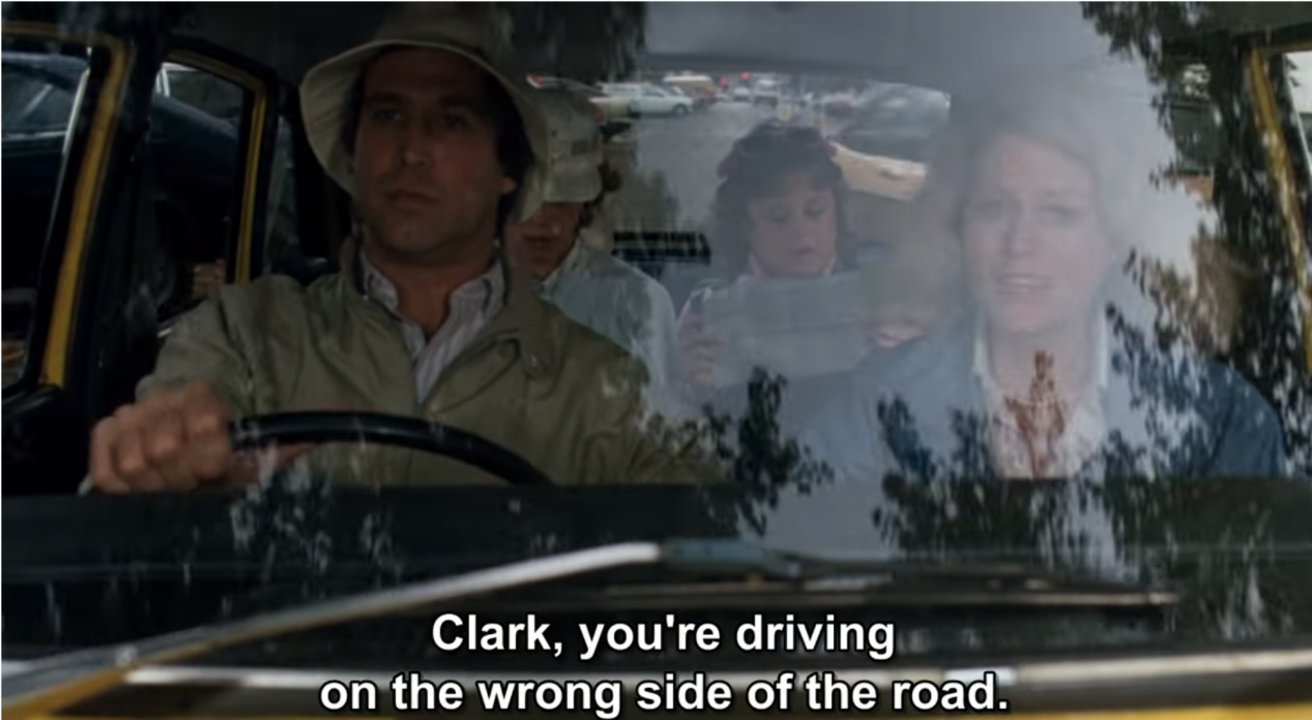 A scene from European Vacation where Clark Griswold drives on the wrong side of the road in England