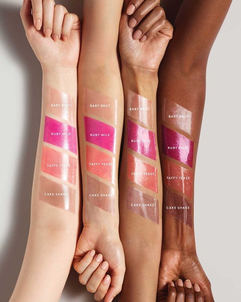 Swatches of the four shades on four arms of different skin tones