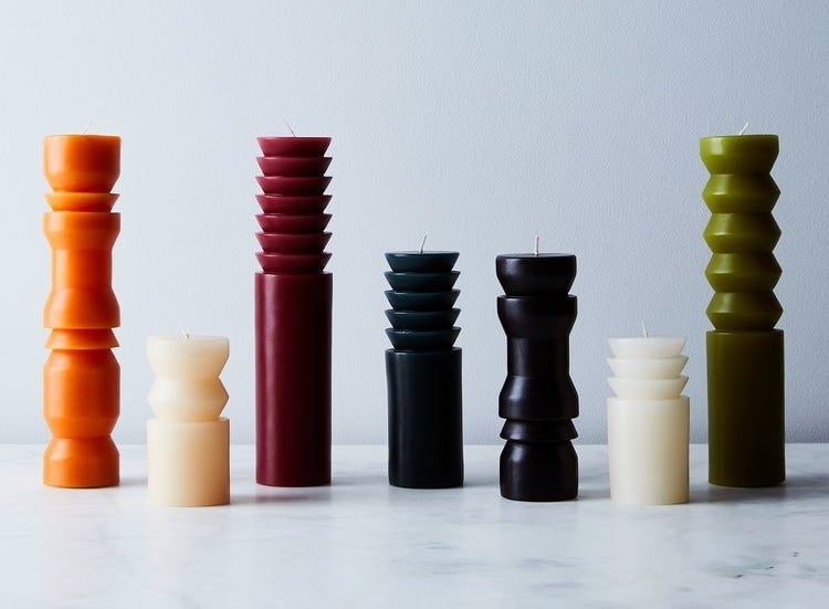 Sculptural pillar candles lined up  