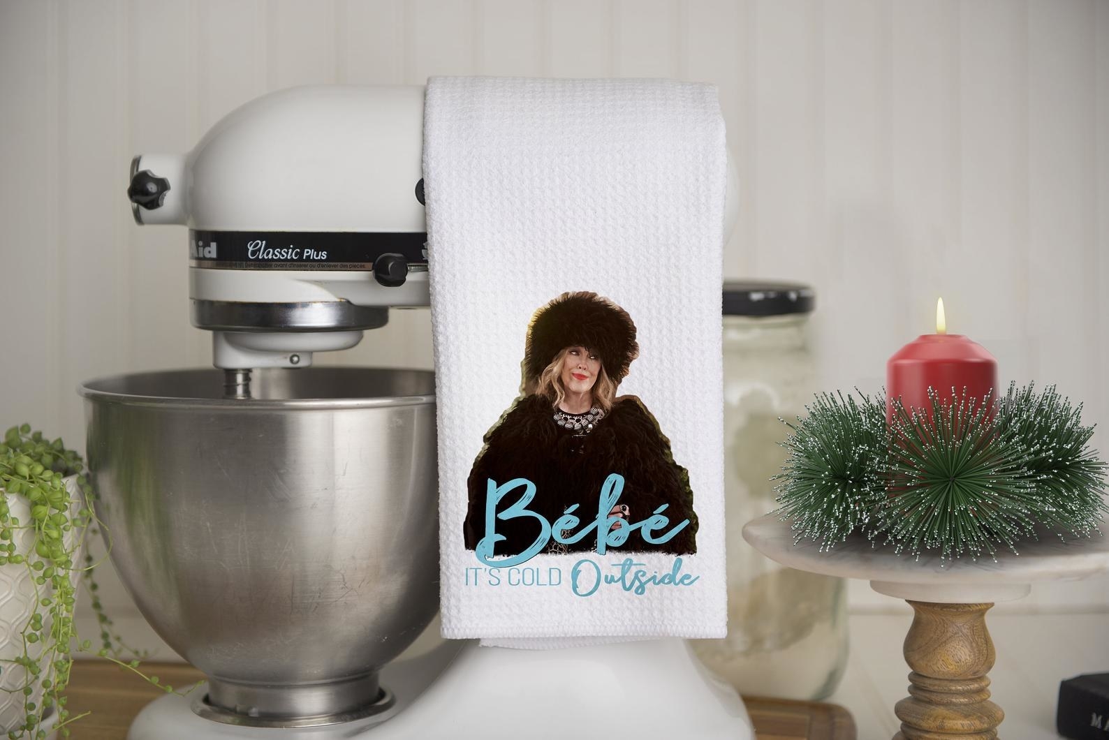 The waffle towel with an image of moira rose and text &quot;bébé it&#x27;s cold outside&quot;