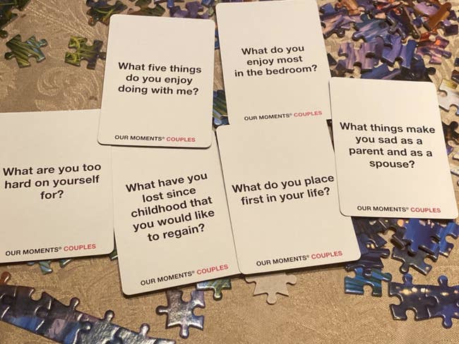 Reviewer photo of some of the cards, which include questions like 