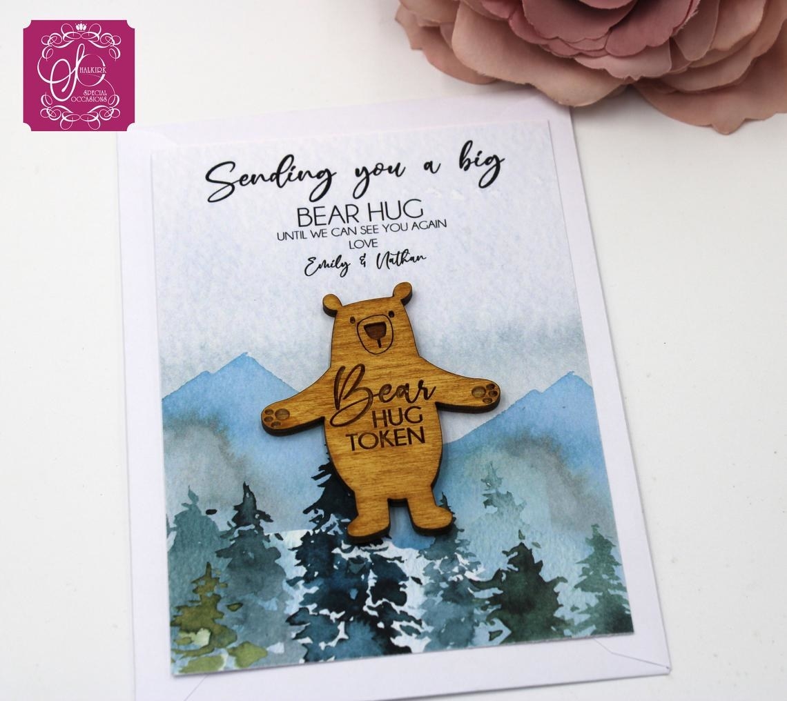 The bear hug token on a personalized notecard