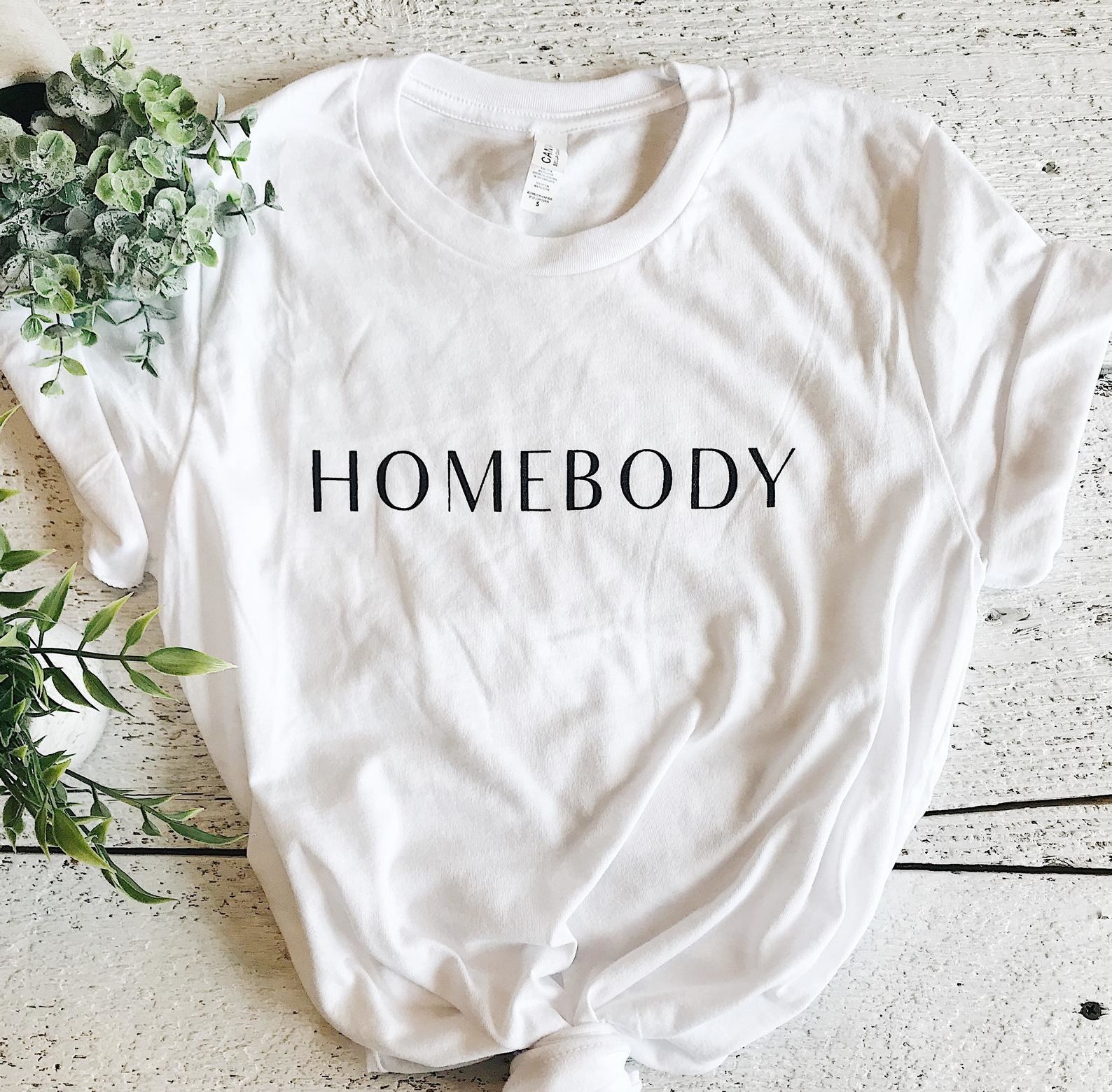 white t-shirt that says homebody