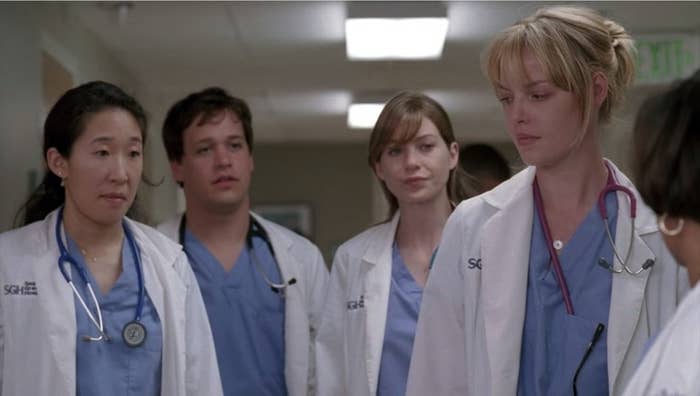 Izzie, Meredith, Cristina, and George looking at Dr. Bailey