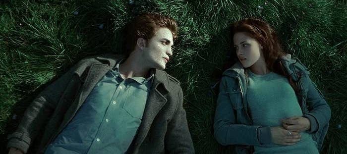 Edward Cullen (Robert Pattinson) and Bella Swan (Kristen Stewart) laying in The Meadow. Edward's skin is glittering.