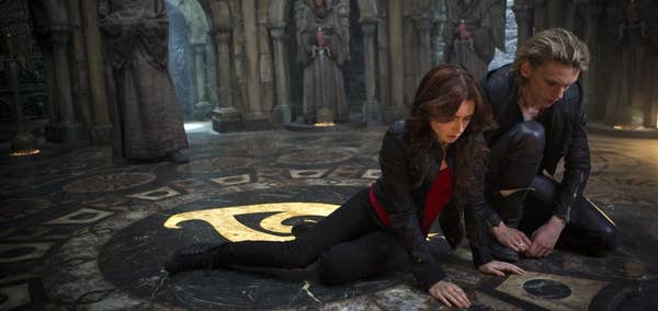 Clary Fray (Lily James) and Jace Lightwood (Jamie Campbell Bower) visit the Silent City.