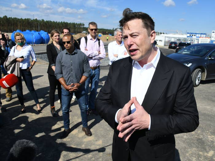 Elon Musk, head of Tesla, speaks to media representatives at the Tesla Gigafactory construction site In Grünheide near Berlin