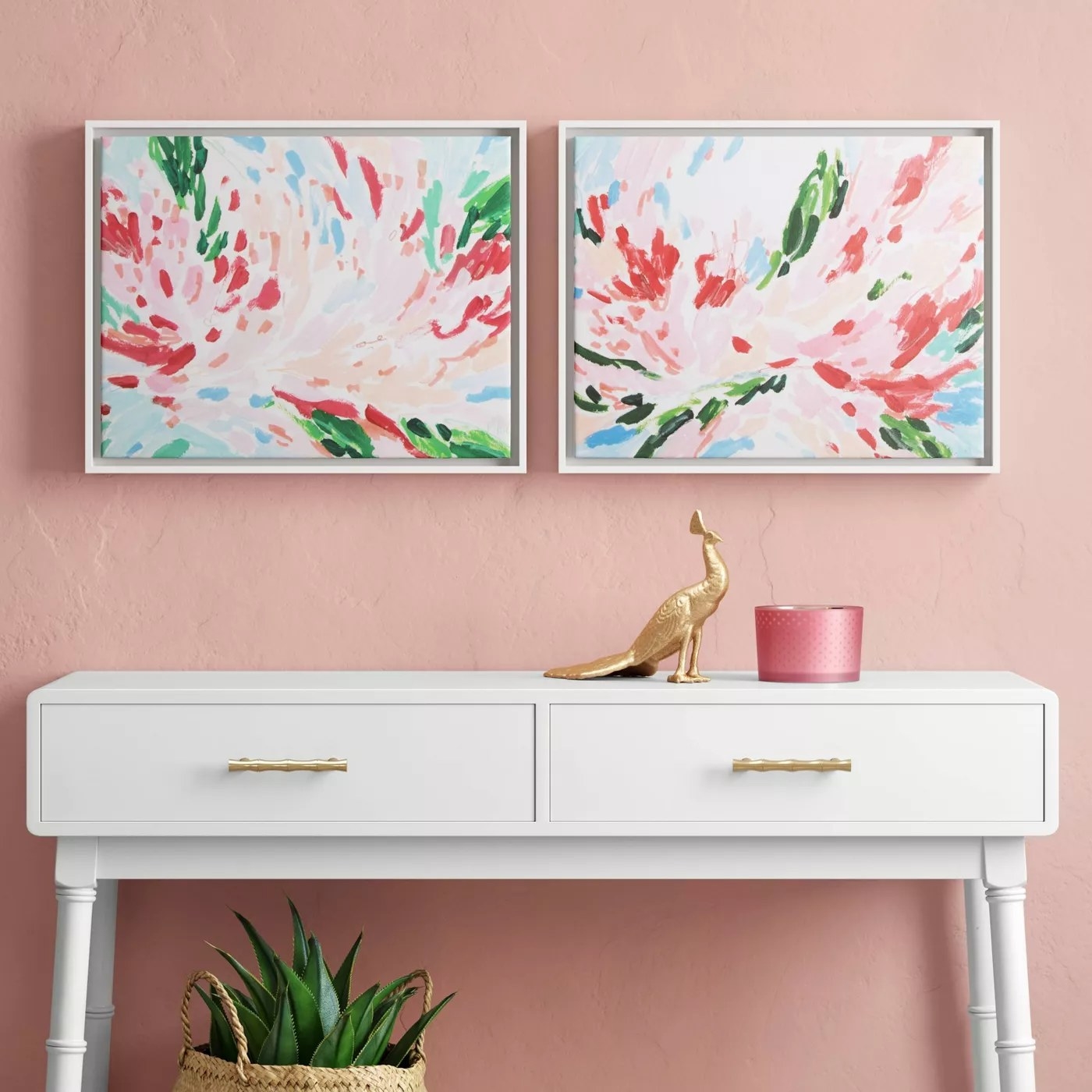 The abstract flower paintings in white frames