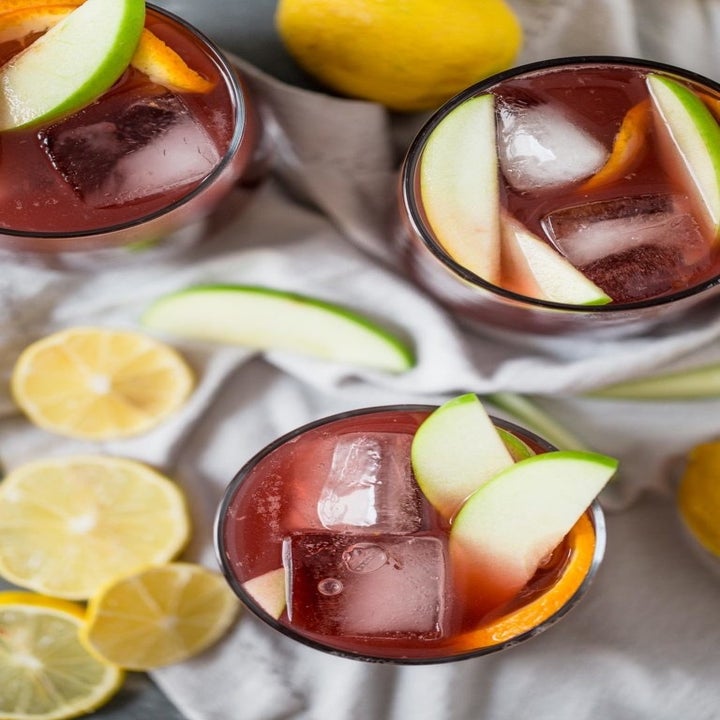 A top-down shot of three glasses of red sangria.