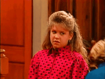 A GIF of DJ from &quot;Full House&quot; letting out a large sigh
