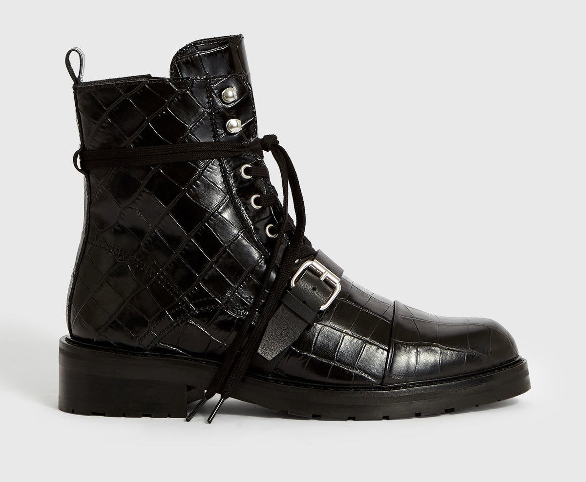 Photo of black crocodile skin boots