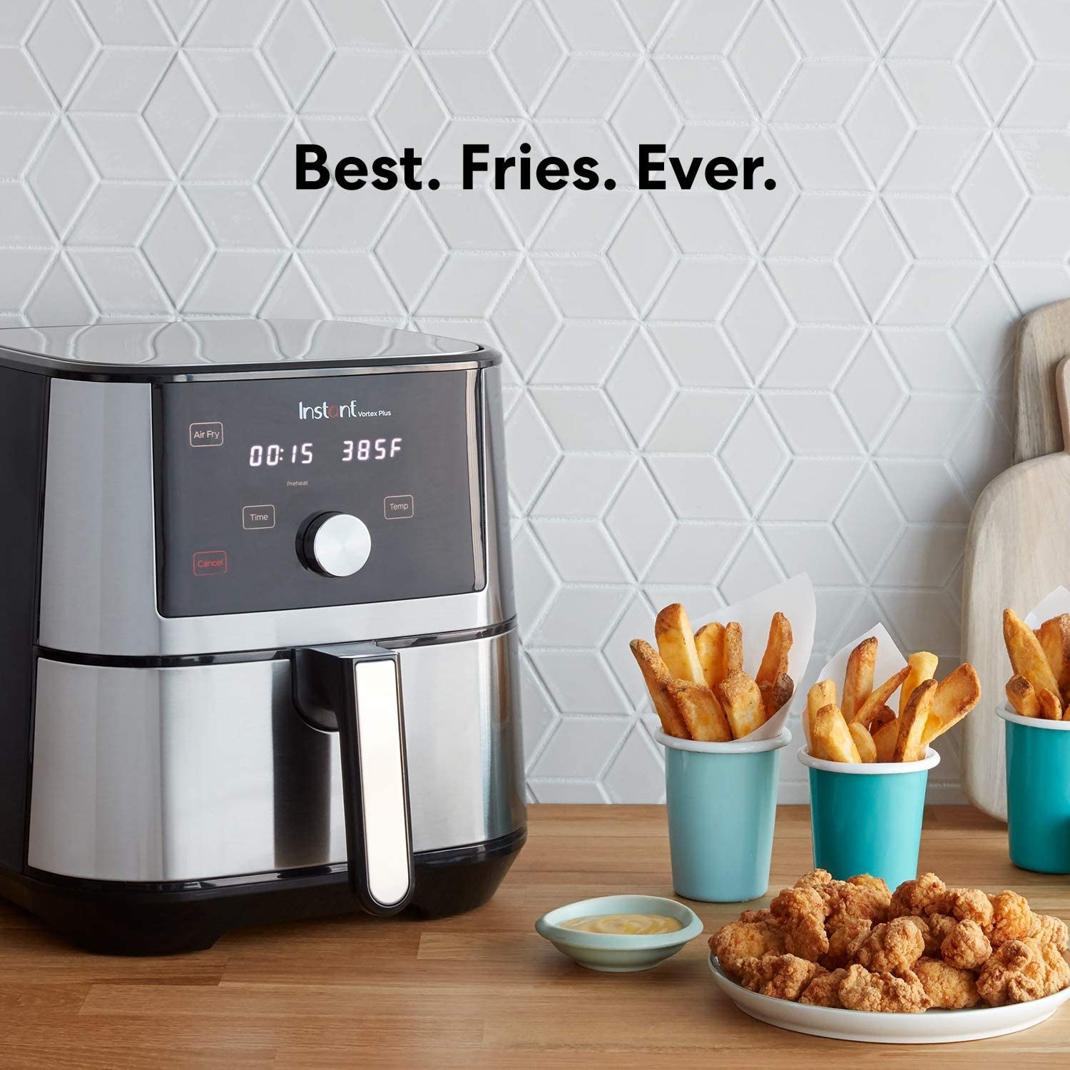 the instant vortex air fryer displayed next to fries and popcorn chicken with text that reads &quot;best. fries. ever.&quot;