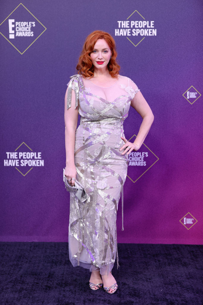 Christina Hendricks wears a gown that features metallic ribbon-like detailing