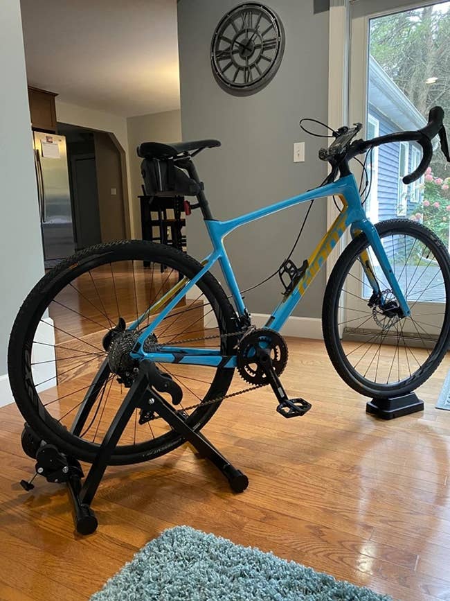 Reviewer pic of the black stand with a bike in it inside