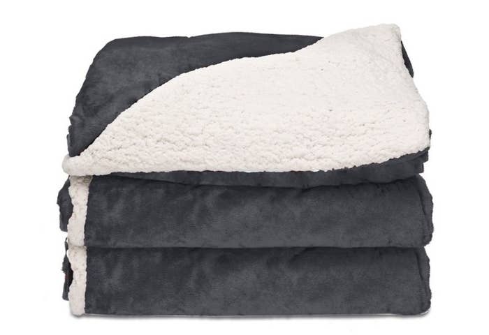 Gray heated blanket with white Sherpa lining