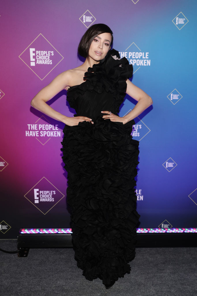Sofia Carson wears a one-shoulder gown that features large, bold ruffles throughout