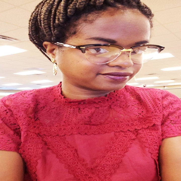 A reviewer wearing the top in red