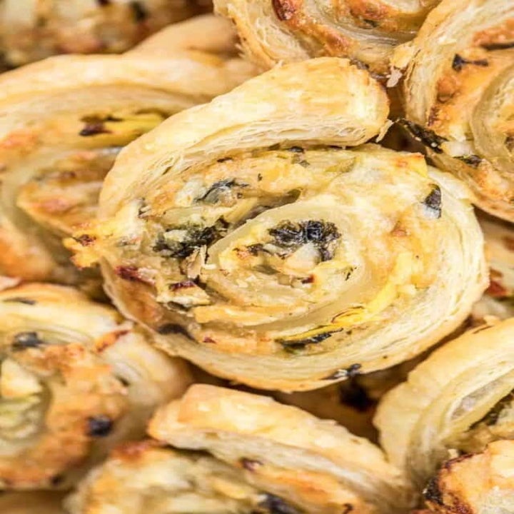 A handful of spinach artichoke pinwheels.