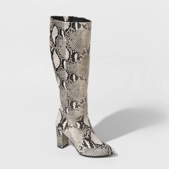 Black and white snakeskin tall boots