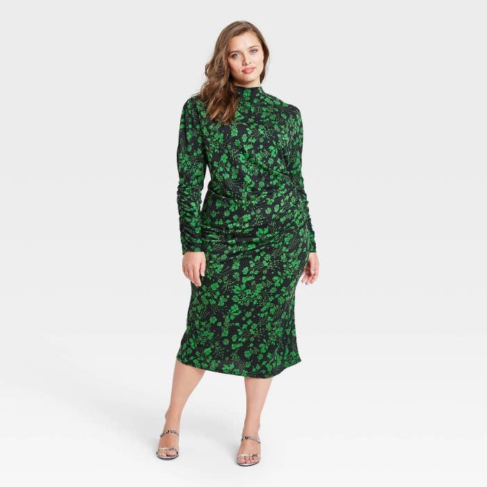 Model in green floral long sleeve dress