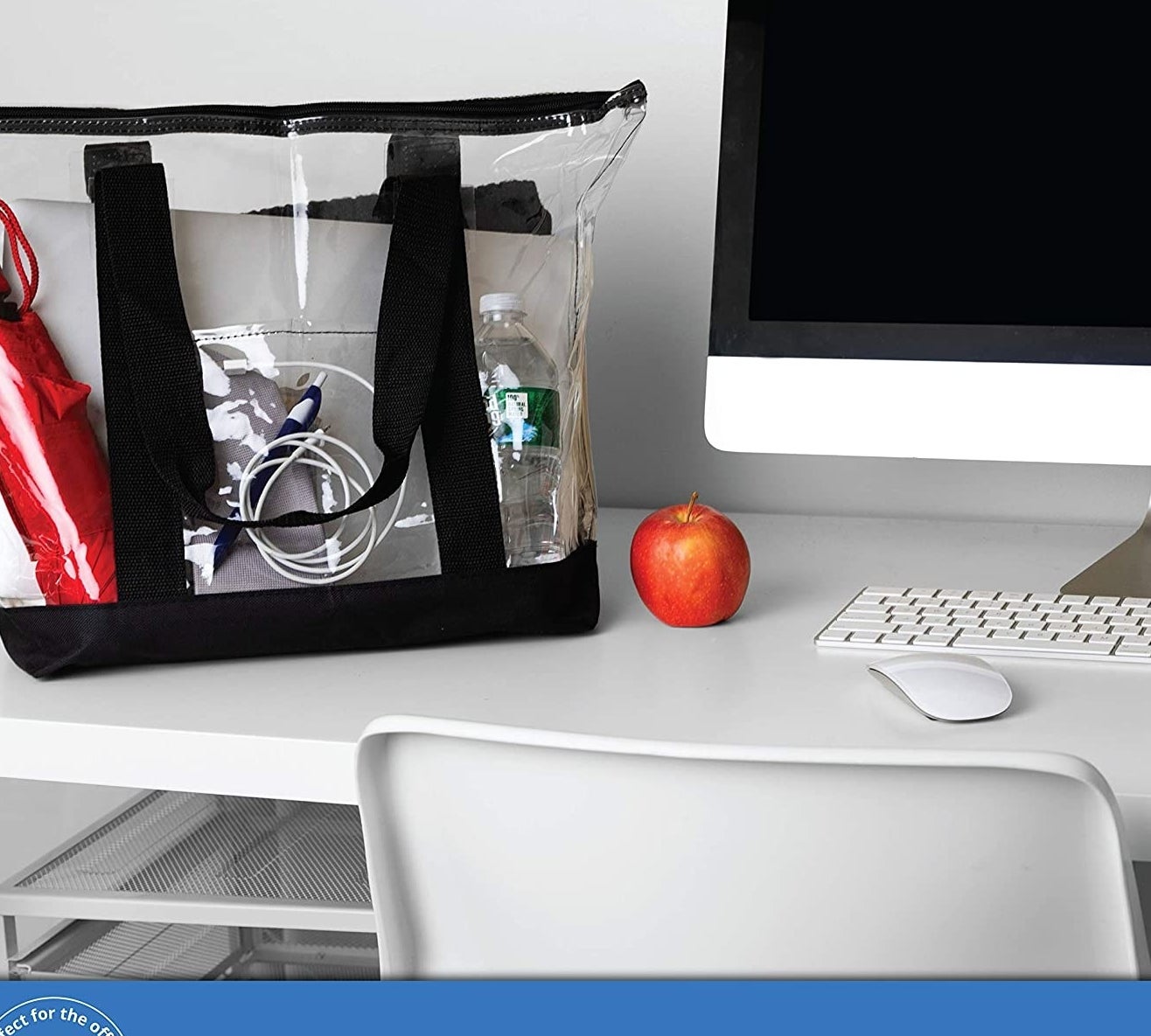 the clear tote bag with an umbrella, water bottle, phone cords, and laptop inside 