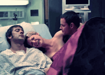 Denny dies and Izzie is crying while Alex tries to pull her off of him. 