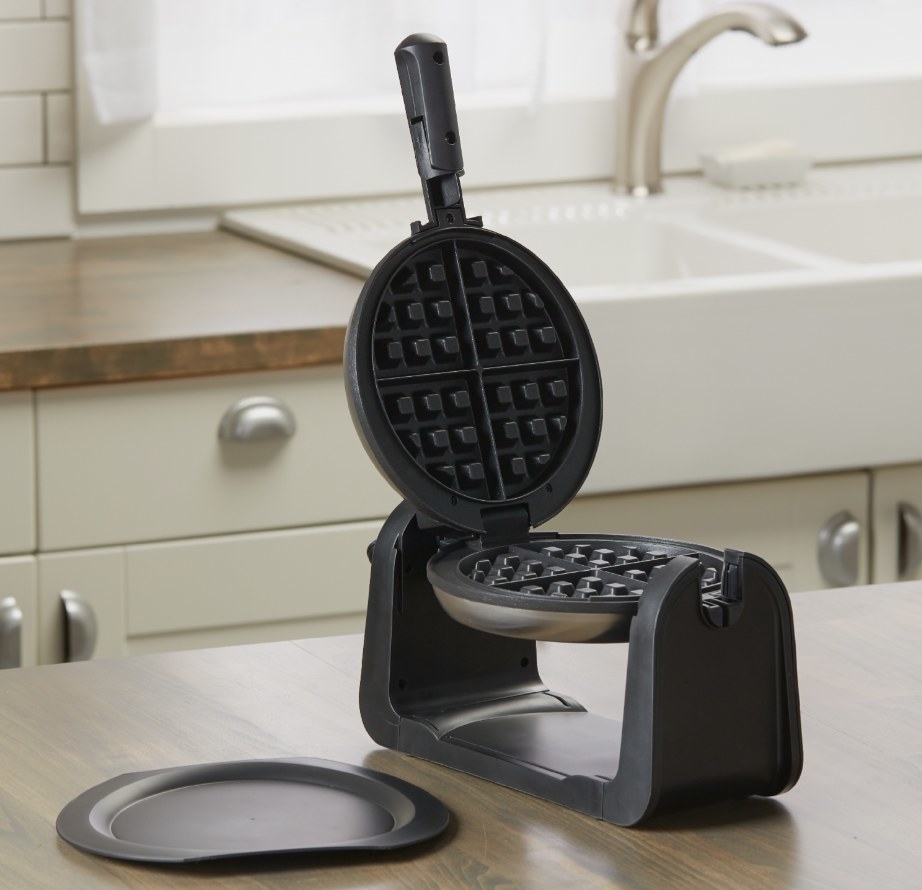 The wafflemaker on wooden counter