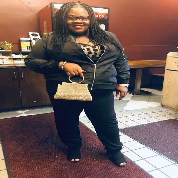 A reviewer wearing the jacket in black