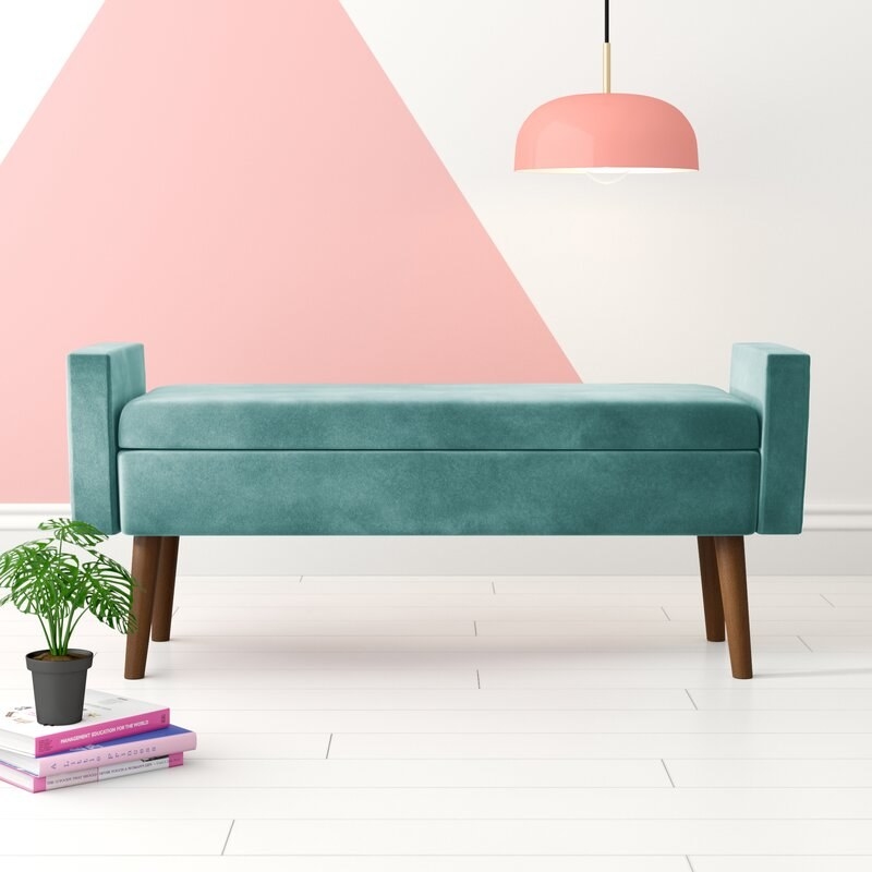 The teal storage bench