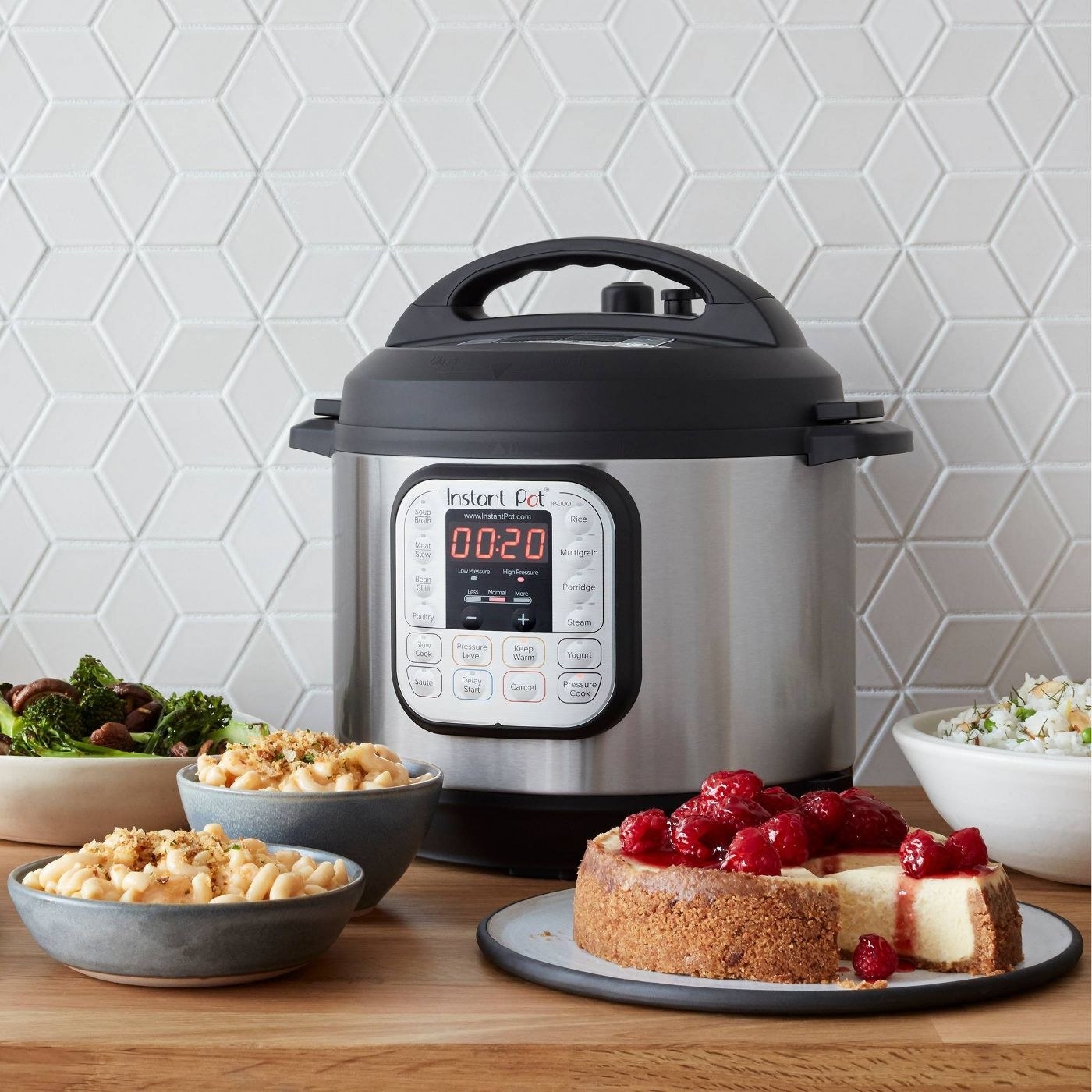 The Instant pot beside several dishes it can prepare
