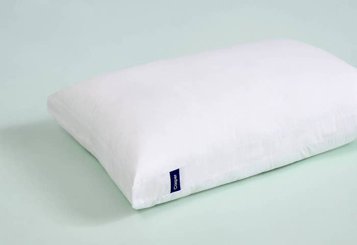 The Casper pillow in a standard size on a mint green background