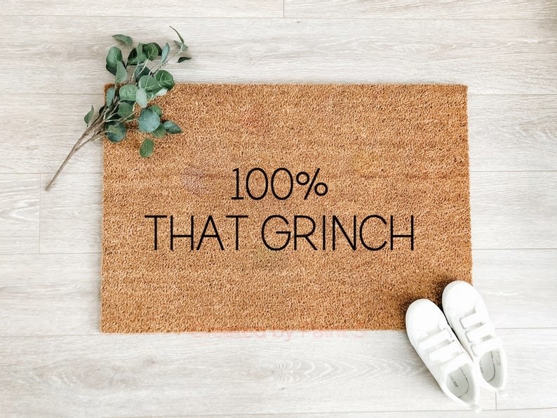 A mat that says 100% that Grinch