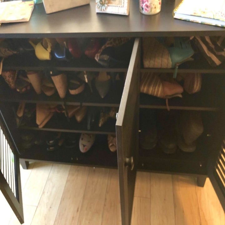 the same Baxton Studio Warren Shoe-Storage Cabinet with doors open to reveal stored shoes