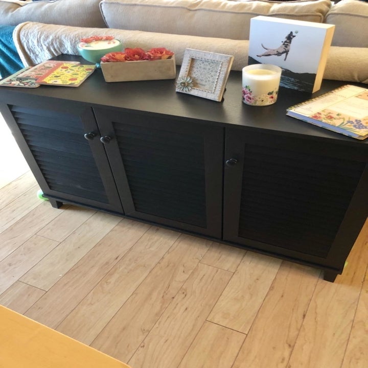 reviewer image of the Baxton Studio Warren Shoe-Storage Cabinet being used as a coffee table