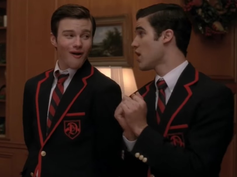 Kurt and Blaine from Glee wearing school uniforms and singing together