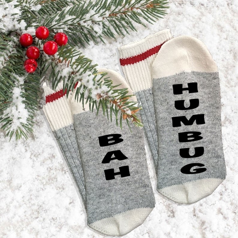 A pair of socks that say bah humbug