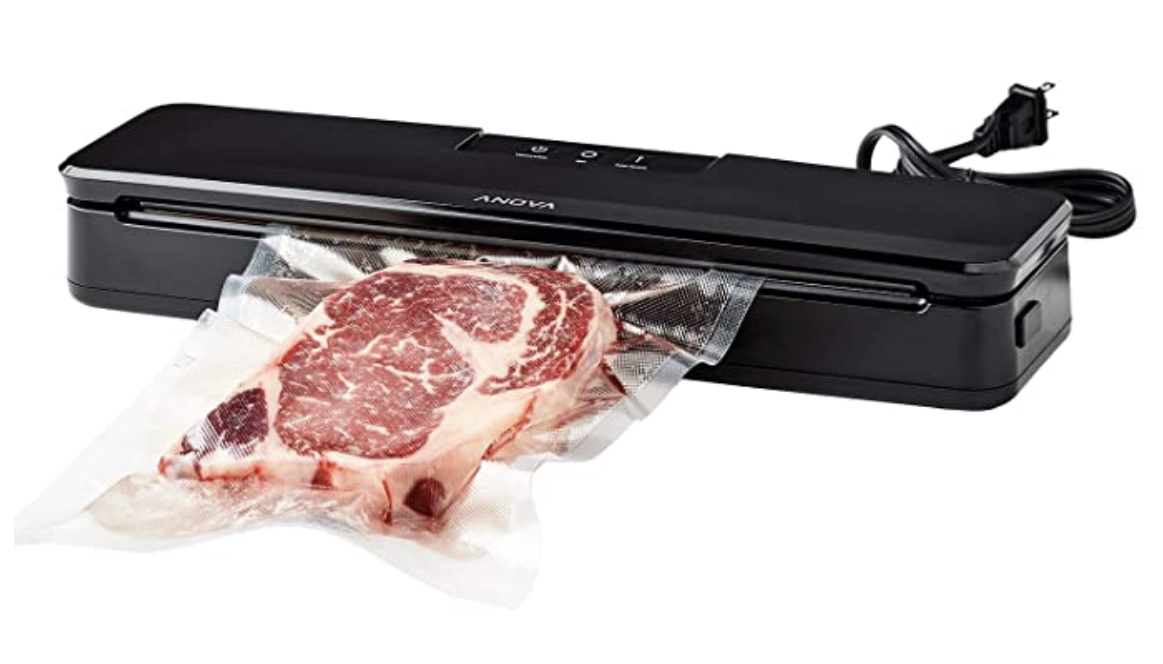 A black rectangular vacuum sealer sealing plastic around a piece of steak meat