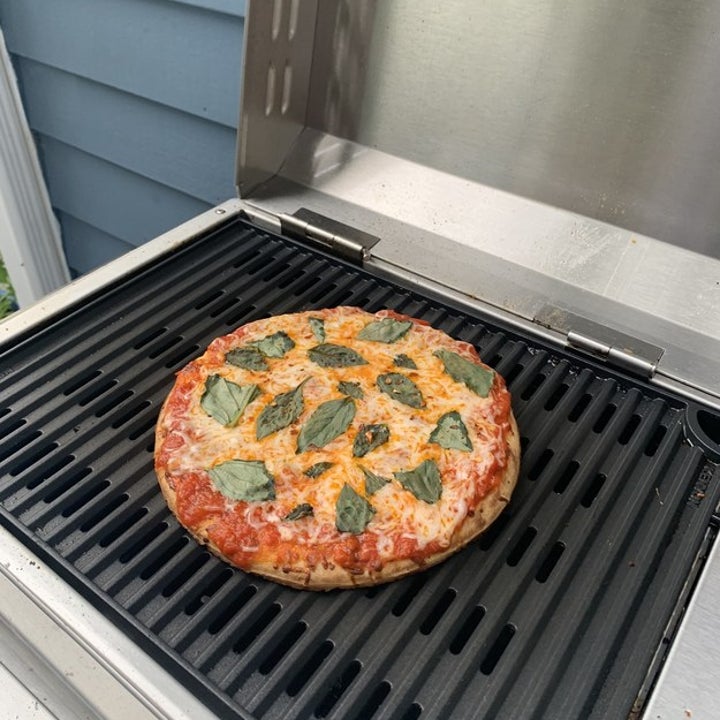 a pizza on the grill