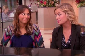 Leslie and Anne from "Parks and Recreation" looking at each other