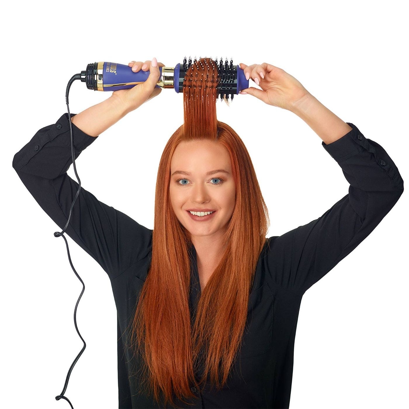 A model using the brush-shaped hair dryer