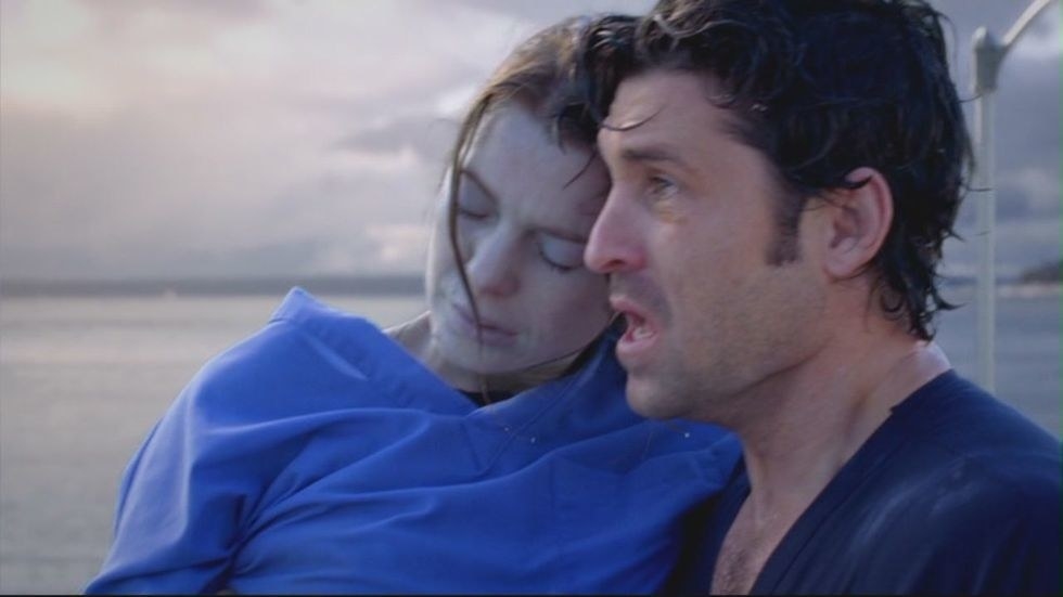 Derek pulling Meredith out of the water after she drowned. 