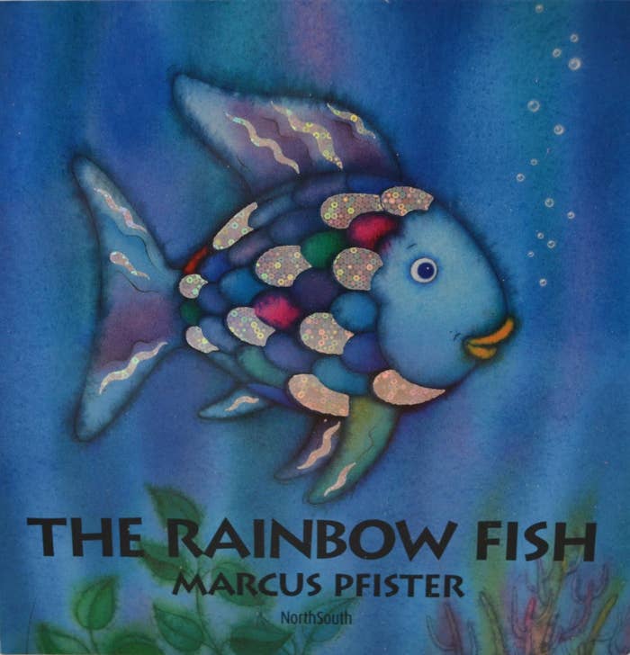 The book cover for "The Rainbow Fish" featuring a blue fish.