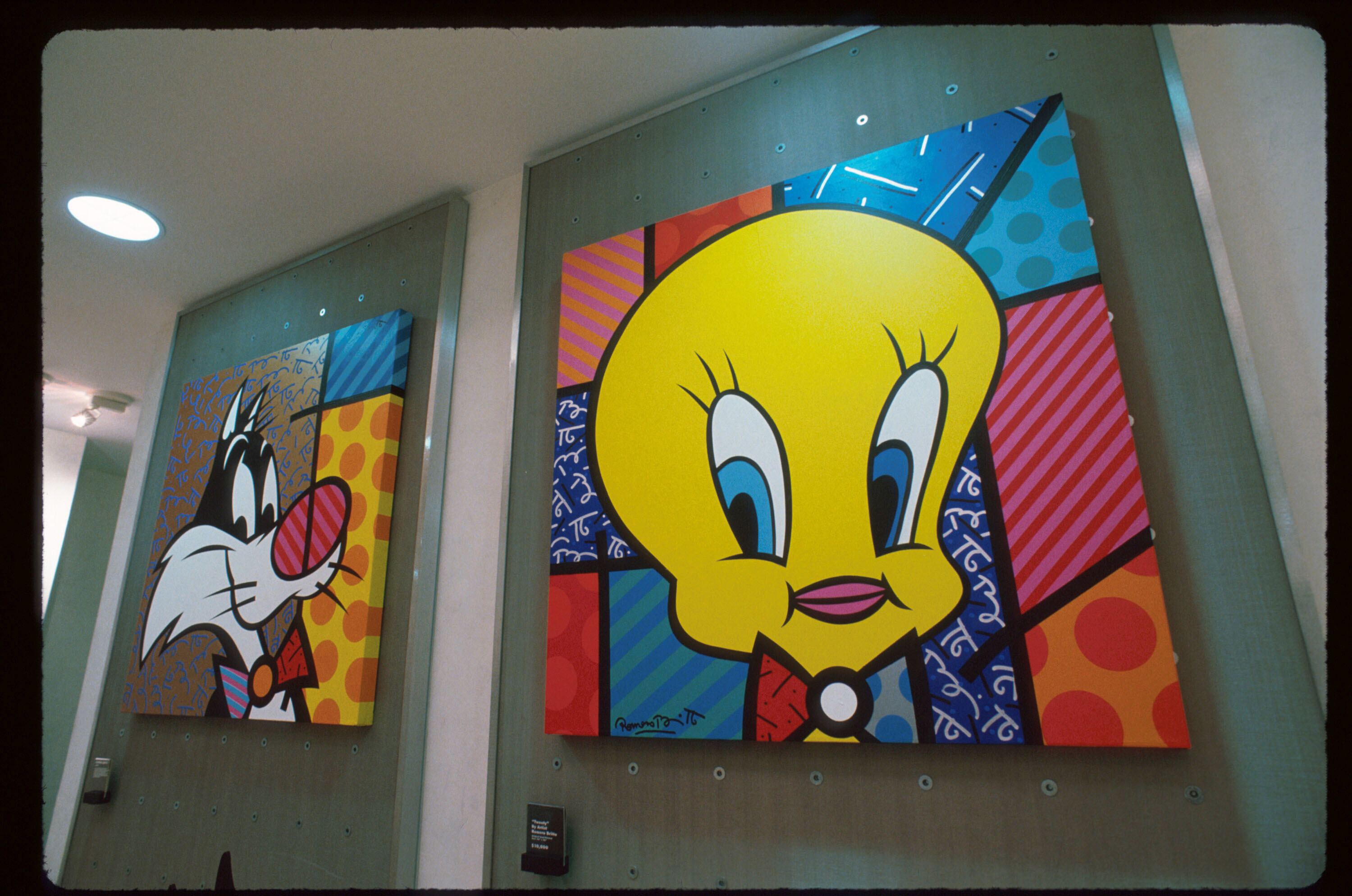Pop art paintings of Sylvester and Tweety.