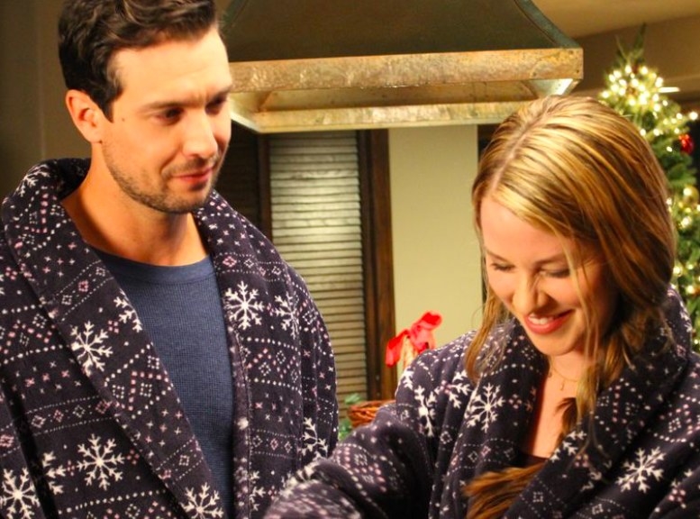  Kim Shaw and Clayton James stand in a kitchen wearing matching dressing gowns