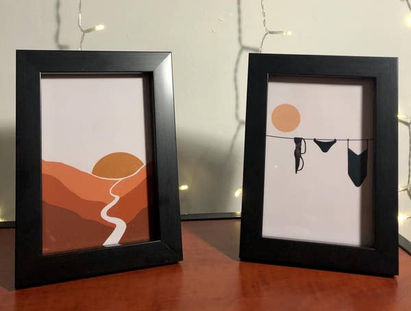 one framed print of a sunset and one of clothes hanging on a clothesline
